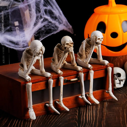 Drie wijze skeletten — openhaarddecoratie voor Halloween
