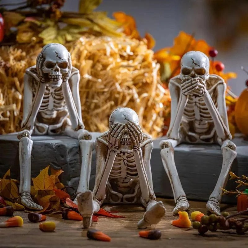 Drie wijze skeletten — openhaarddecoratie voor Halloween