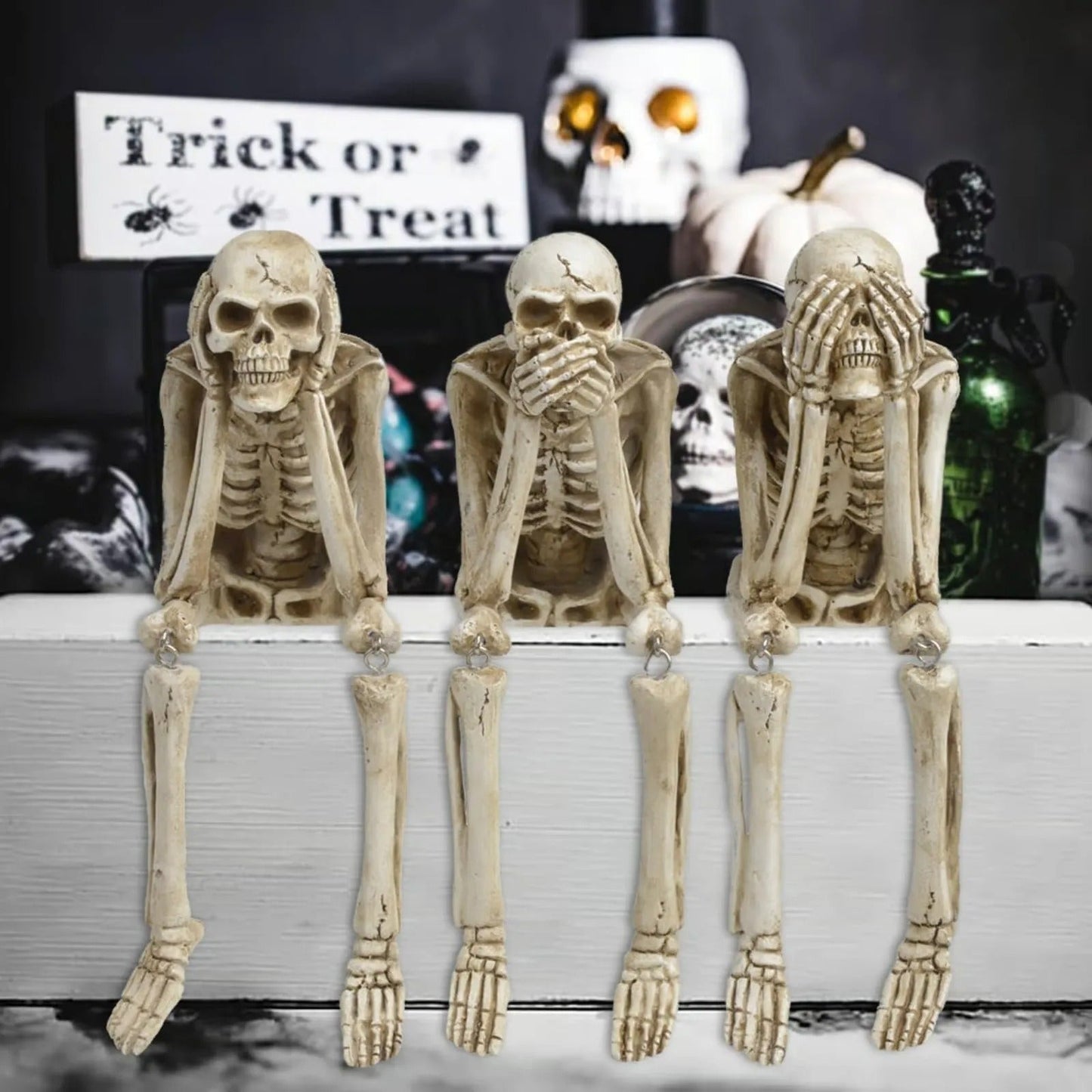 Drie wijze skeletten — openhaarddecoratie voor Halloween