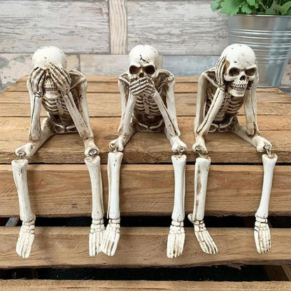 Drie wijze skeletten — openhaarddecoratie voor Halloween
